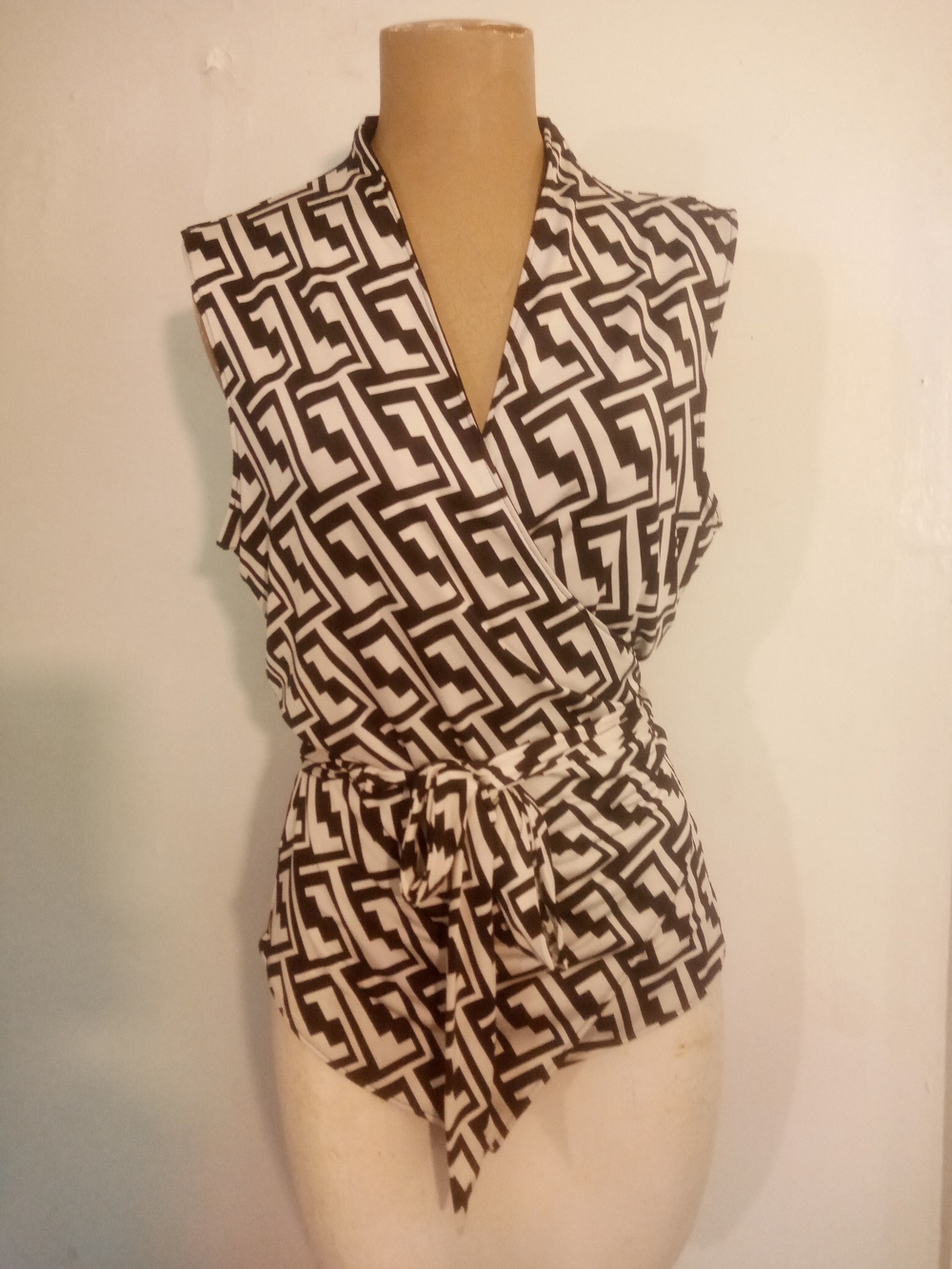 Sleeveless Black & White Geometric Wrap Blouse with Tie Waist